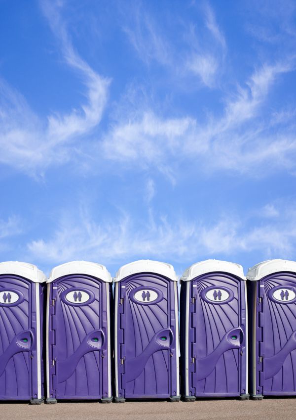 Festival porta potty rentals lined up at an outdoor event in Newark and North Jersey